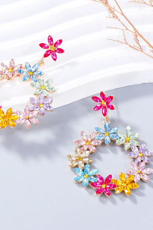 Floral halo drop earrings with multicolor crystal flowers and gold alloy.
