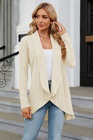Drape-front cable knit cardigan in Tan with a waterfall neckline and asymmetrical hem.