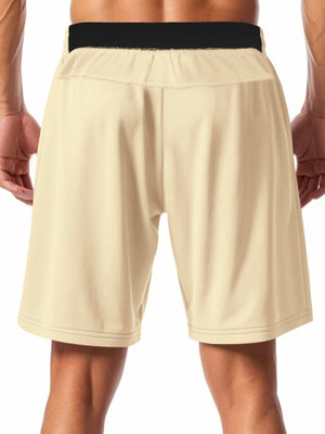 Apricot chino shorts with drawstring waist and black elastic band detail.