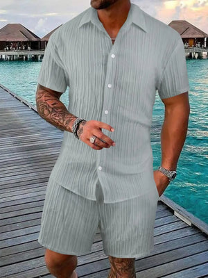 Textured gray resort shirt and shorts set with button-down short sleeve shirt and elastic waist shorts.
