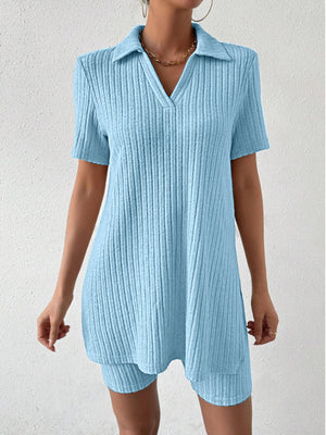 Light blue ribbed polo shirt and shorts co-ord set with a v-neck and collar.