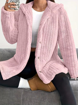 Pink button-up fleece jacket with a hood and cozy texture.