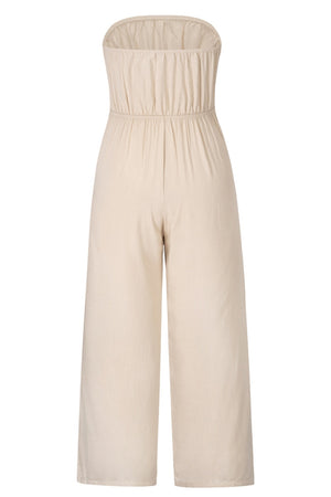 Tan bandeau tie-waist wide-leg jumpsuit with smocked bodice and cropped length.
