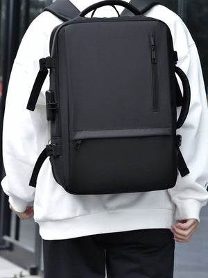 Black convertible commuter backpack with multiple zippers and side straps.