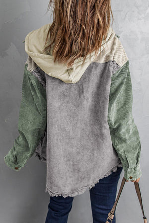 Colorblock corduroy hooded utility jacket in sage green, gray, and tan with frayed hem.