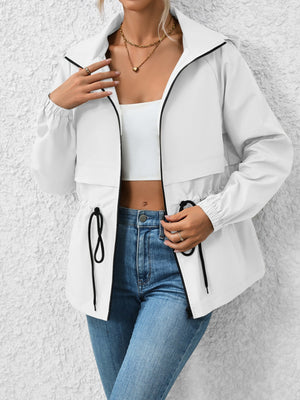 White hooded utility jacket with cinched waist and black trim details.