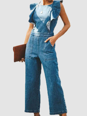 Medium wash denim jumpsuit with ruffled cap sleeves and wide legs.