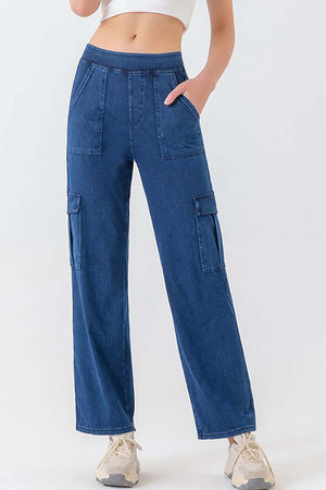 Utility denim cargo pants in dark blue with multiple pockets and a relaxed fit.
