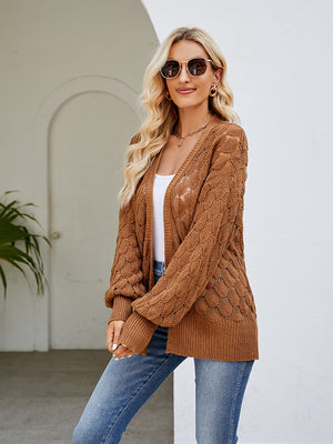 Camel open-knit balloon sleeve cardigan with textured detail and relaxed fit.