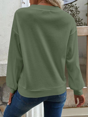 Matcha green waffle knit button-down cardigan with long sleeves.