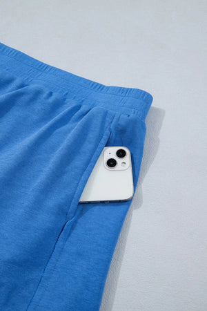 Blue pocketed skort with elastic waistband and phone detail.