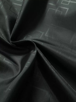 Black hooded jacket fabric with subtle geometric pattern detail