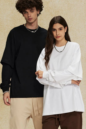 Oversized long sleeve tee in black and white with layered sleeve detail.