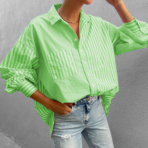 Neon green striped oversized button-down shirt with pocket and cuffed sleeves.