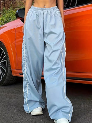 Light blue wide-leg maternity pants with gathered waistband and white side stripe detail.