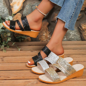 Glistening sequined wedge sandals in black, silver, and gold with comfortable slip-on style.