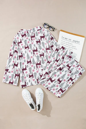 White reindeer print pajama set with long sleeves and pants.