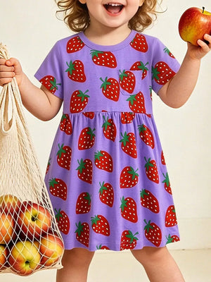 Purple cotton blend toddler dress with allover red strawberry print and chest pocket.
