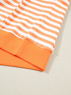 Oversized orange and white striped cotton t-shirt with ribbed cuffs and hem.
