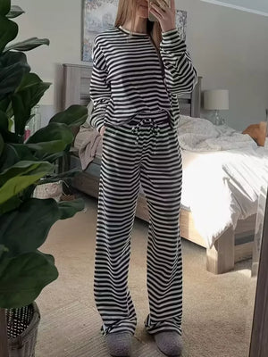 Chic striped two-piece lounge set with drawstring pants and long sleeve top.