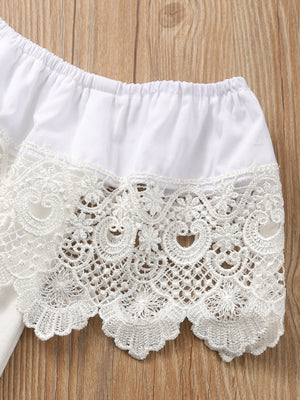 White off-shoulder cotton top with intricate lace trim detail.
