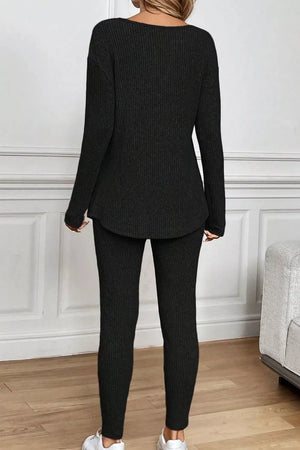 Black ribbed loungewear set with long sleeves and leggings.