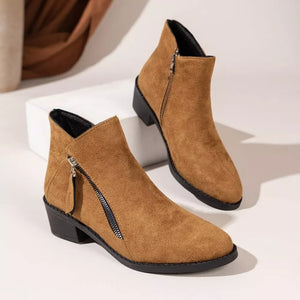 Caramel suede ankle boots with pointed toe and side zipper detail.