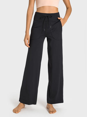 Black utility pocket wide-leg lounge joggers with drawstring waist and relaxed fit.