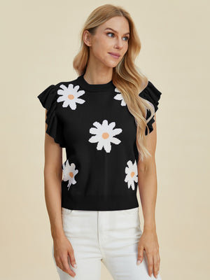 Black knit top with white daisy print and ruffle cap sleeves