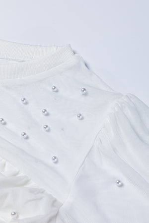 White mesh bodysuit with pearl embellishments and ruched detail