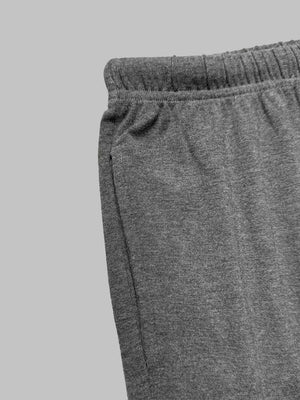Grey drawstring pants with elastic waistband and side pocket detail.