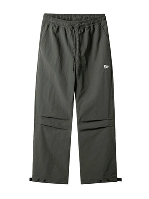 Dark gray utility joggers with drawstring waist, cargo pockets, and adjustable ankle cuffs.
