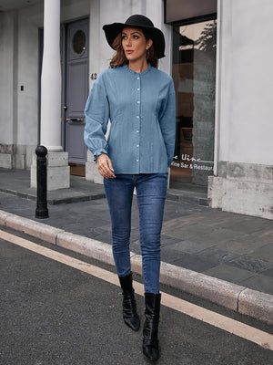 Dusty Blue textured ruffle collar peplum blouse with button front and long sleeves.