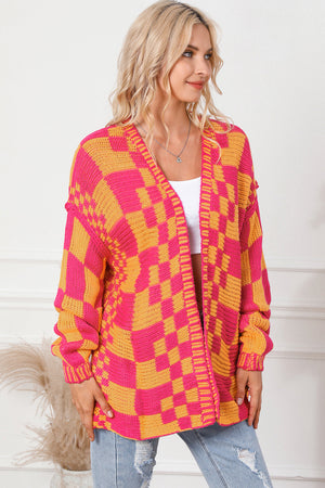 Checkerboard knit open cardigan in orange and pink acrylic with a relaxed fit.