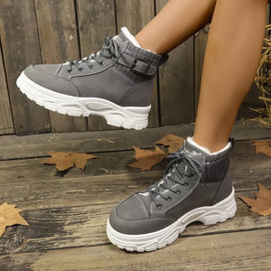 Dark gray lace-up boots with plush accents and buckle detail.