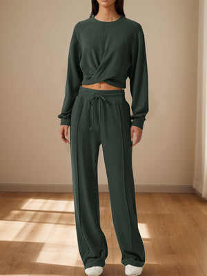 Army green knit lounge set with a cross-front crop top and wide-leg pants.
