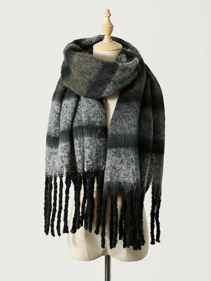 Ombre stripe scarf in black with fringe detail.
