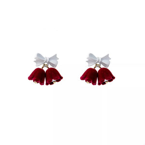 Velvet bow-embellished bell earrings in deep red with white bows.
