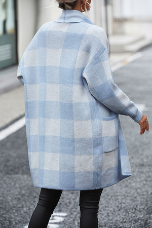 Light blue and white checkerboard knit duster coat with pockets.