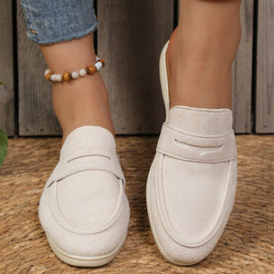 Textured round toe slip-on loafers in light beige with a backless design.