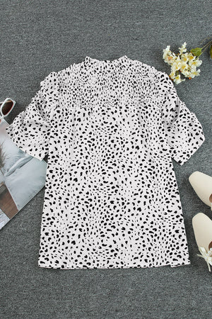 White dalmatian print blouse with shirred yoke and short sleeves