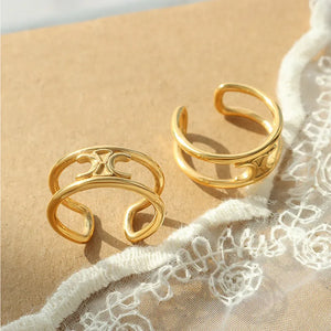 Gold double banded open ring with cutout detail.
