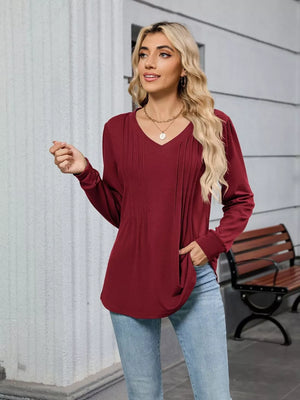 Burgundy V-neck long sleeve maternity t-shirt with subtle pleating detail on the chest.