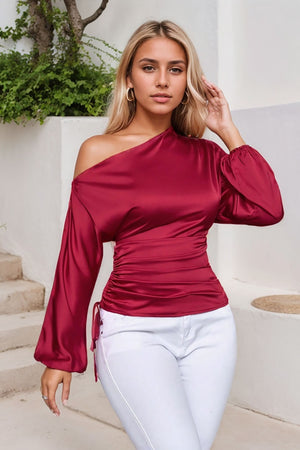 Deep Red satin blouse with asymmetric neckline, ruched side detail, and balloon sleeves.