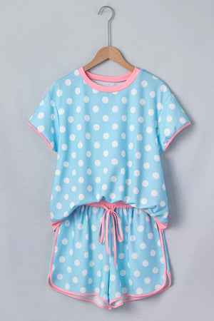 Pastel blue polka dot pajama set with pink trim and drawstring shorts.