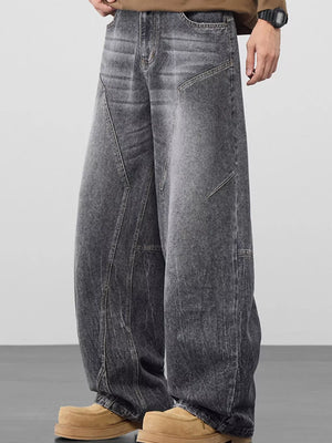 Refined wide-leg jeans in Black Gray with geometric panel detailing and a relaxed fit.
