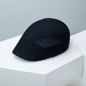 Black mesh flat cap with textured weave detail