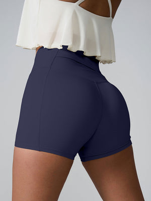 Navy active shorts with sculpted pocket detail and high waist