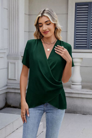 Dark green short sleeve blouse with draped front and V-neck.