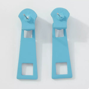 Blue zipper drop earrings with square cutouts and alloy posts.